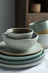 Stylish empty dishware on table indoors, closeup