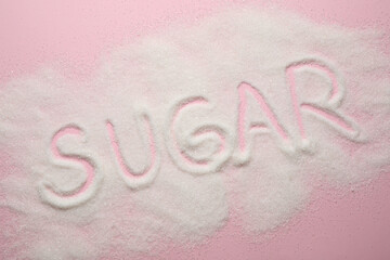 Composition with word SUGAR on pink background, top view