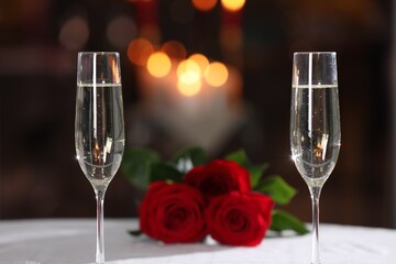 Glasses of champagne on table in restaurant. Romantic dinner