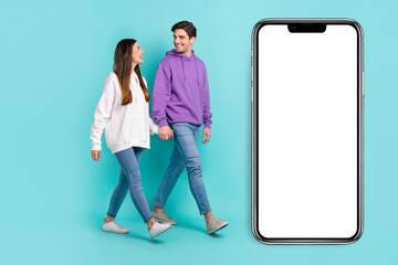 Full size photo of casual wear couple go on date holding hands telling jokes laughing isolated on...