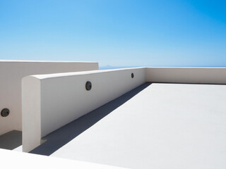 White painted rooftop with blue sky on Santorini, Greece