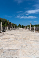 Street of the city of Ephesus, with the marble columns on the sides, on a sunny day