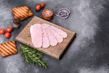 Sliced ham on wooden background. Fresh prosciutto. Pork ham sliced