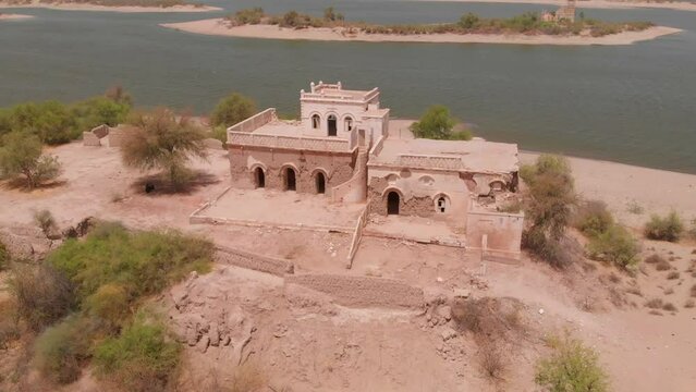 Ruined house in the middle of the desert in Chotiari Dam from the Sanghar town in Sanghar District, Sindh, Pakistan