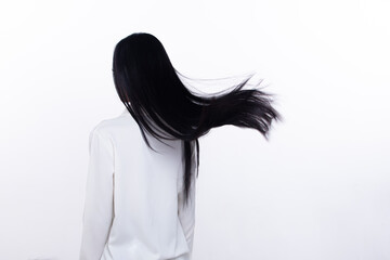 Black Straight Long Black Hair woman throw fly in air with fashion stylish and fun joy. Female turn...