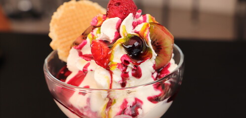 a yogurt sundae with fruit and whipped cream