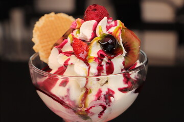 a yogurt sundae with fruit and whipped cream