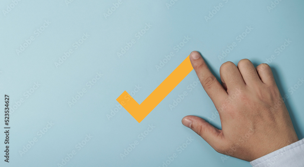 Poster Hand writing yellow tick correct mark on blue background for approve document and project concept.
