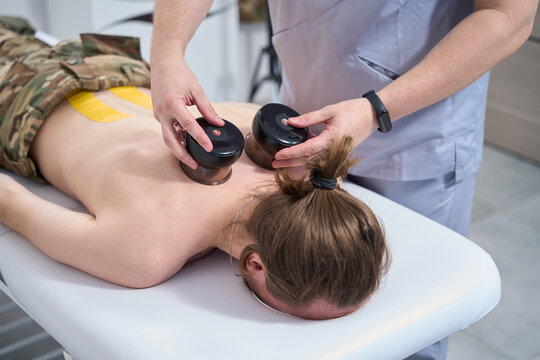 Physiotherapist in a rehabilitation ward conducts a medical procedure