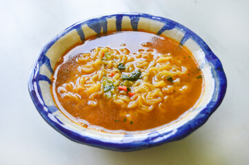 A bowl of a spicy korean ramen with the selective focus. Good for any project. 