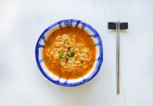 A bowl of a spicy korean ramen with the selective focus. Good for any project. 