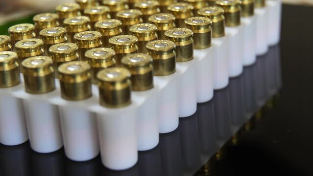 Rows in a box of 9MM bullet ammunition - turning close up