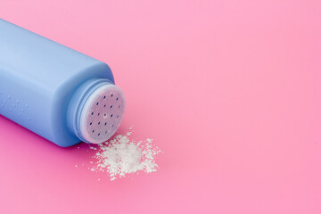 Skin care with talcum powder in container. Spilled white powder