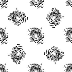 Seamless pattern of hand drawn sketch style leopards isolated on white background. Vector illustration.