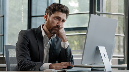 Tired lazy napping yawn adult bearded man male manager worker bored at work project online in...