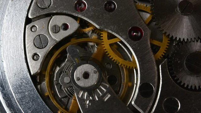 Clockwork. Macro shot of clock mechanism. Gears. Artistic blur
