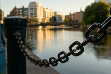 Naklejka premium Romantic harbor scene with a quiet channel and a metal chain