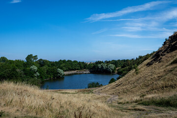 Landscape with St. Margaret's Loch from St. Anthony's Chapel in Edinburgh in Scotland