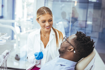 Obraz premium A perfect result of a dentist’s work which is seen in the beautiful and white smile on a patient who is absolutely satisfied with a result of a treatment given in a clinic. 