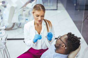 A perfect result of a dentist’s work which is seen in the beautiful and white smile on a patient who is absolutely satisfied with a result of a treatment given in a clinic. 