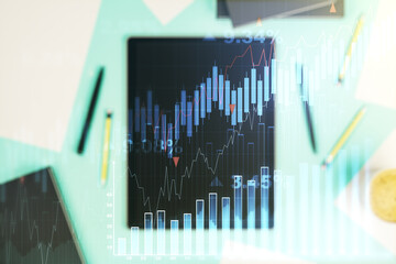 Multi exposure of abstract creative financial chart and digital tablet on background, top view, research and analytics concept