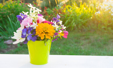 Beautiful bouquet of garden flowers in sunlight
