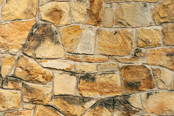 Texture of wall cladding with broken stone