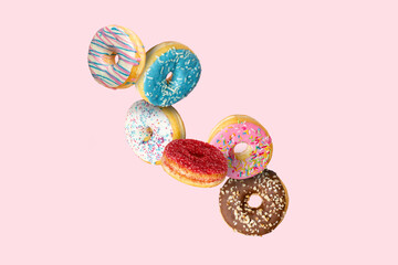Confectionery as cakes, sweets, doughnuts collage on background. Colourful donuts, cookies,...