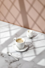 Coffee cup, hot drink in a mug. Beige and marble background with window shadow. Sunny, sunshine. Cappuccino in coffee cup.
