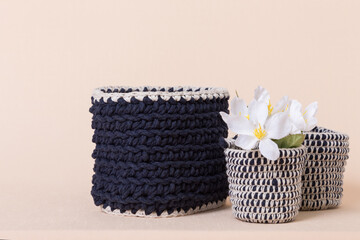 Hobbies and creativity, crochet. Knitted basket organizers handmade from natural cotton for storing things, for cosmetics and personal accessories, interior decor and organizing home space and comfort