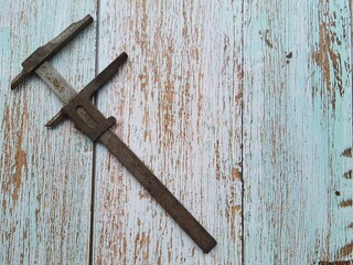 Caliper close-up, isolated on a wooden table, top view, space for text.