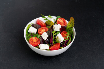 Fresh salad in big white bowl