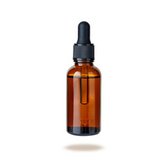 Dark brown glass bottle of face serum or essential oil or pharmaceutical tincture isolated on white - obrazy, fototapety, plakaty
