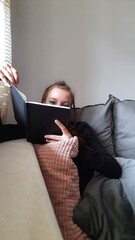 person watching tv on sofa