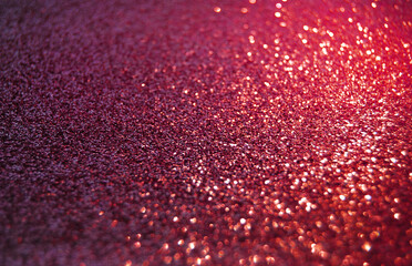 Purple de focused sparkle glitter background with golden particles close up