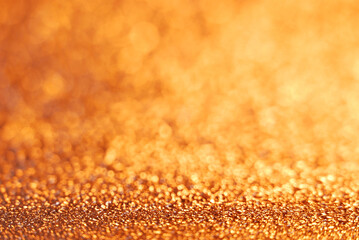 Golden de focused sparkle glitter background close up