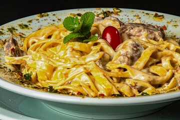 four cheese pasta with filet mignon escalope.