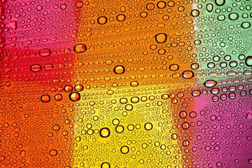 Macro photography of the dew on the food tape lightened through tape color filters. 