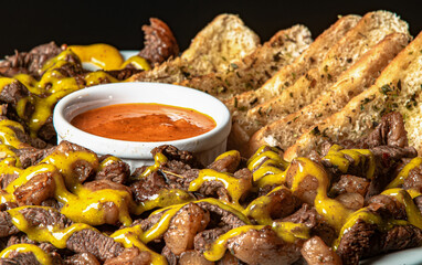 grilled picanha served with salad and cream.