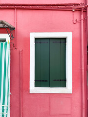 Windows in the colorful house in Burano