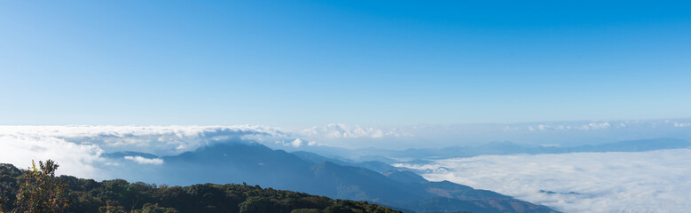 Fototapeta premium Kiew Mae Pan Viewpoint, Chom Thong District in Chiang Mai on Doi Inthanon with beautiful views of Blue sky and clouds on the weather day, mountains and grass, and nature mist in winter.