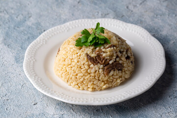 From traditional delicious Turkish cuisine; Bulgur pilaf with meat (Turkish name; etli bulgur pilavi)