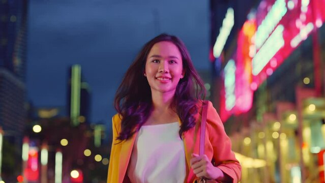 enjoy city lifestyle night lightlife asian female adult woman stylish cloth yellow jacket confident smiling walking at office building corridor facade walkway streetside cafefree woman bokeh light