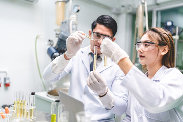chemical medicine scientist working research for CBD oil from organic cannabis hemp plant in...
