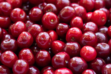 Cherry background. Cherry top view. Sour cherry flat design. Fruit macro.