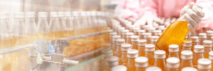 Web banner engineers drink factory glass bottles Inspecting production fruit juice drinks that have been produced large numbers wearing tight protective clothing order best quality before being sell