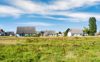 Panoramic view for typical houses with straw roof in small village Vitte on Hiddensee island, Germany.