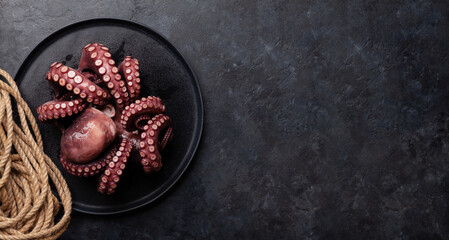 Tasty octopus on black background