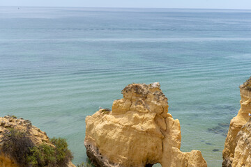 The rocky cliffs of Vale do Olival beach in Armacao de Pera, Portugal