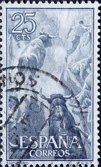 Spain - CIRCA 1960: a postage stamp from Spain, showing a bull in the arena at traditional Spanish...